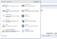 A close-up of a hand printing a document from a laptop screen displaying the user-friendly Canon Printer Assistant Software.
