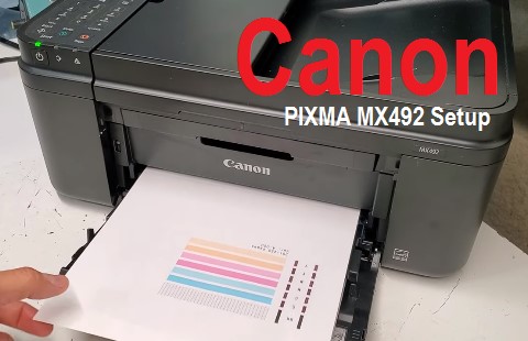 Canon PIXMA MX492 printer with a laptop on a desk, symbolizing a successful setup process.