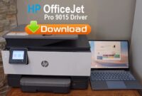 HP OfficeJet Pro 9015 printer connected to a laptop with a cable.