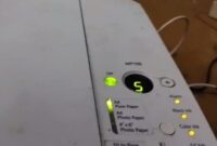 Canon Pixma printer with error code e5 message on computer screen.