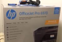 HP Officejet 6970 printer and driver installation screen on computer monitor