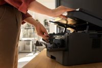 imgi 106 side view employee using printer 23 2149713703